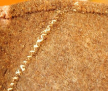 Фактура сермяжной ткани коричневого оттенка. 