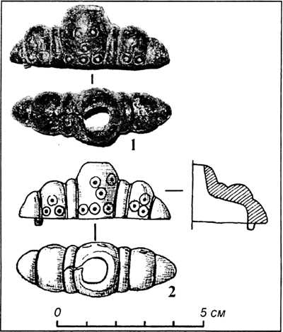 Головка навершя руків'я меча з Чорнівського городища (1 – фото, 2 – прорисовка).